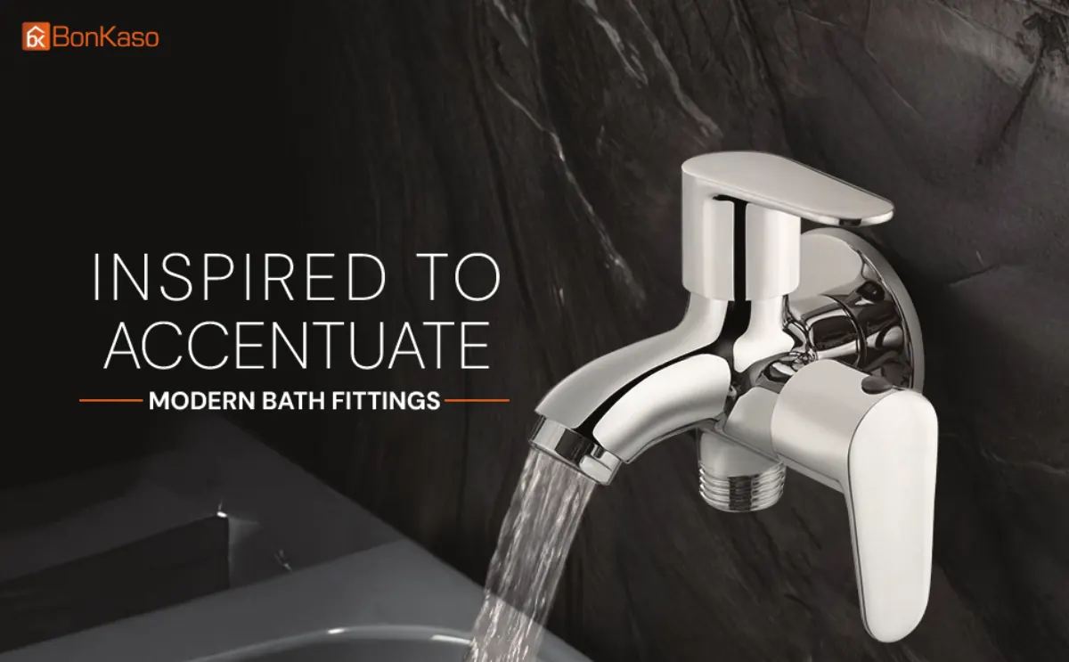 A chrome tap running water on dark stone: inspired to accentuate, modern bath fittings