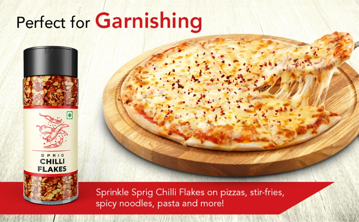 The chilli flakes jar beside a cheese pizza: perfect for garnishing
