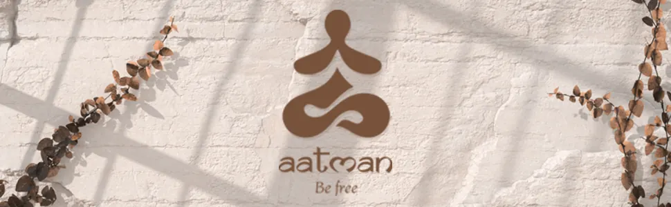 The brand’s logo on a white brick wall with leaves, and the words Be free