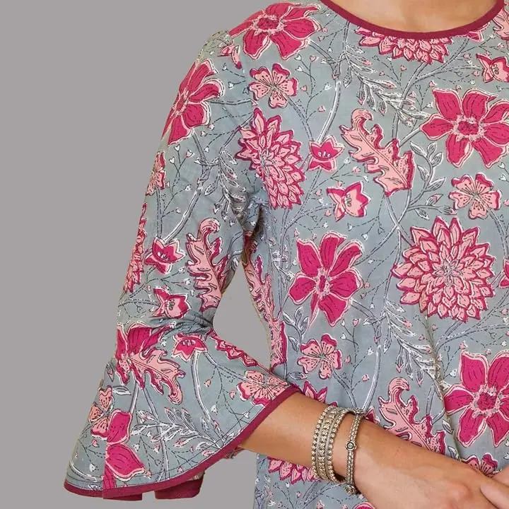 A close-up of the kurta’s floral print and bell sleeve