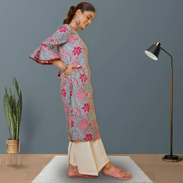 A woman wearing the kurta with cream palazzos