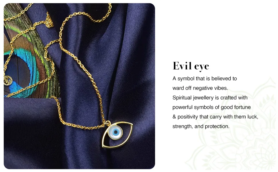 The evil eye pendant on navy silk with a peacock feather: a symbol believed to ward off negative vibes