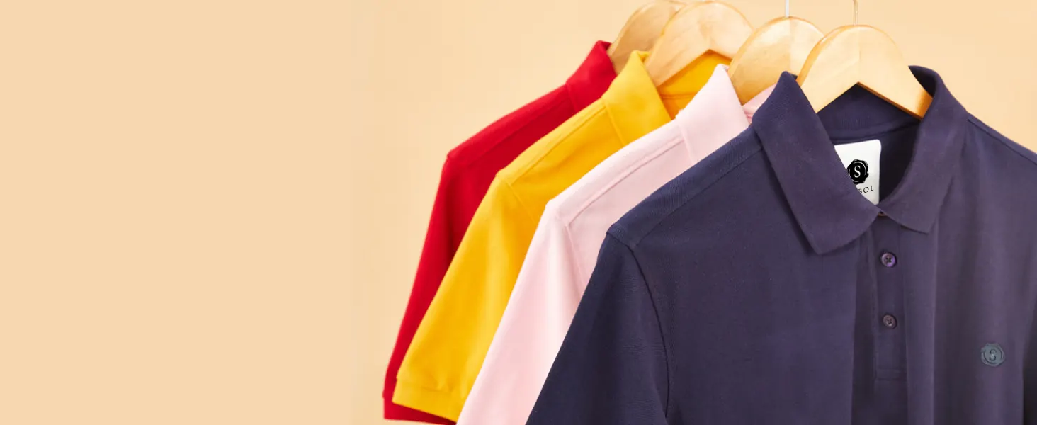 Polo shirts on hangers in red, yellow, pink and navy