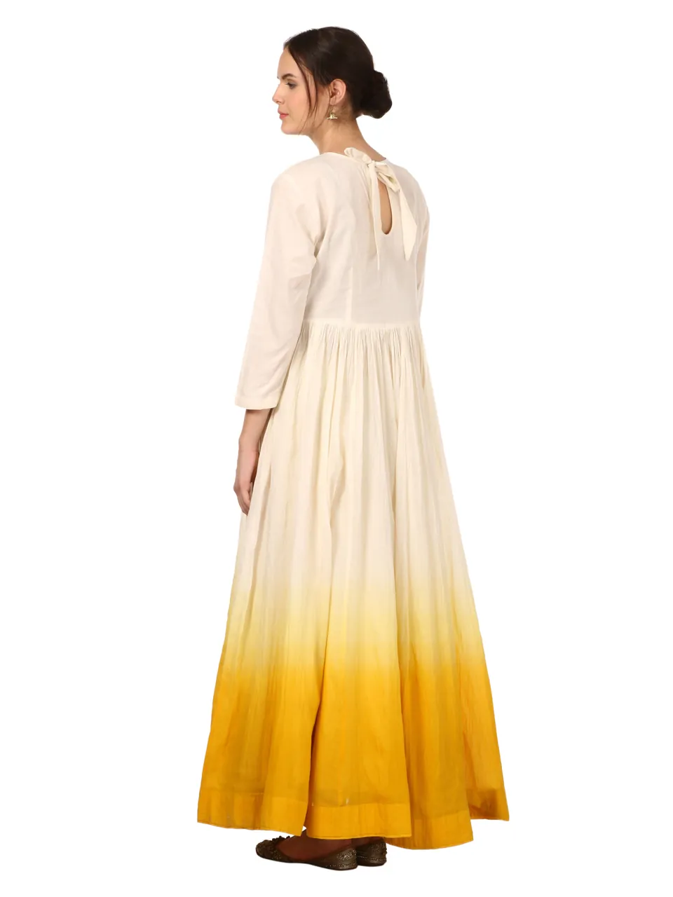 Back view of the anarkali, the model looking over her shoulder, on white