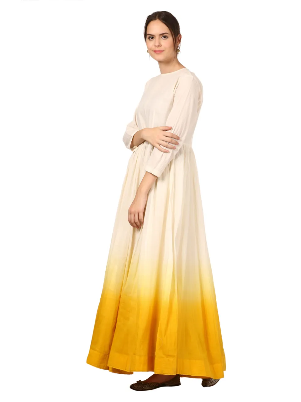 The same cream and mustard anarkali from the side, the model turned 45 degrees, on white