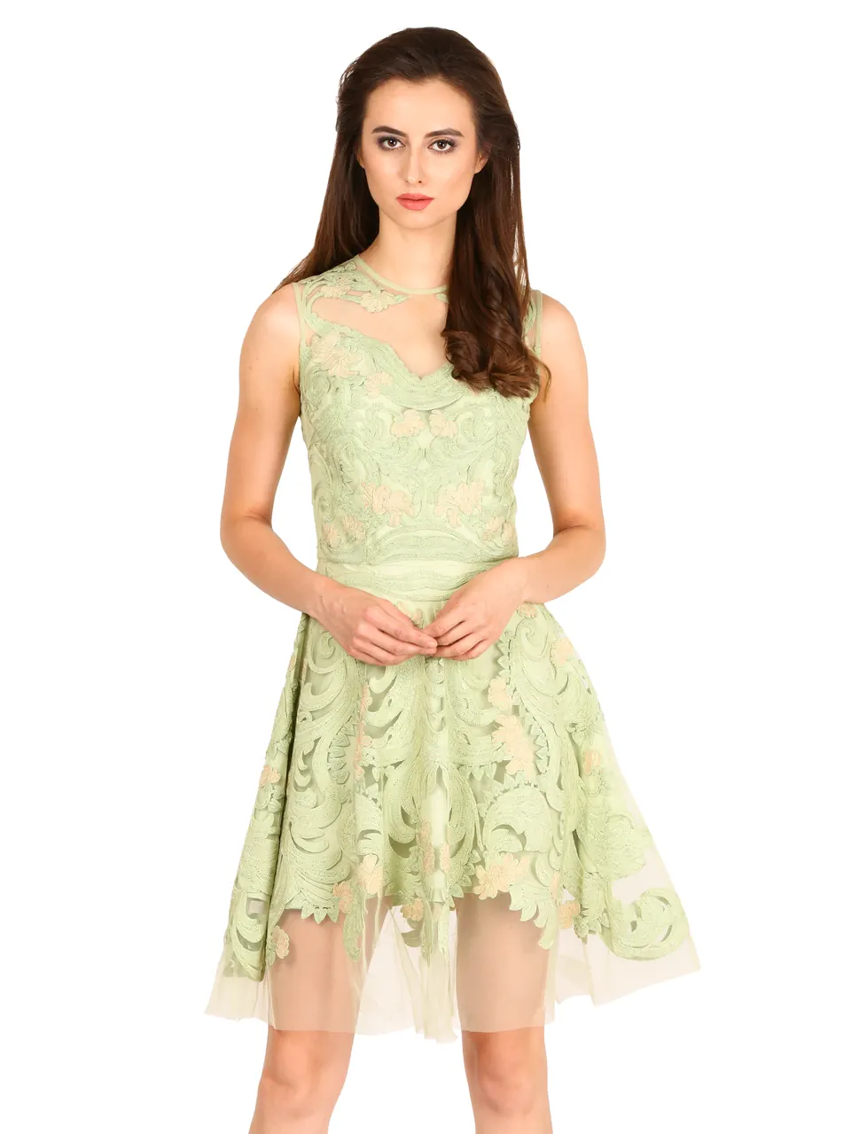 A model in a mint lace dress with a tulle hem, on white