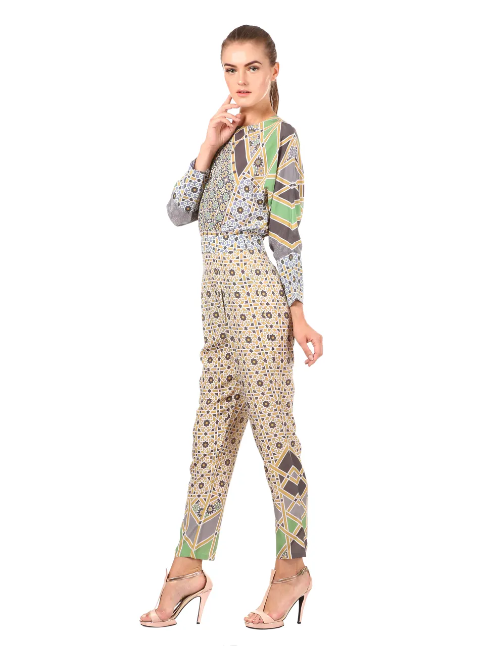 A model in a printed long-sleeve jumpsuit, side view, on white