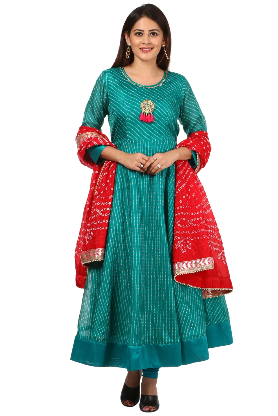 A female model in a teal anarkali kurta with a red bandhani dupatta, shot full length on white