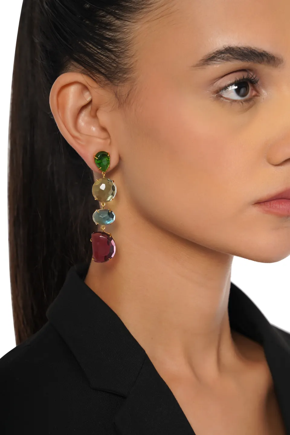 Close-up of a model wearing a long gemstone drop earring
