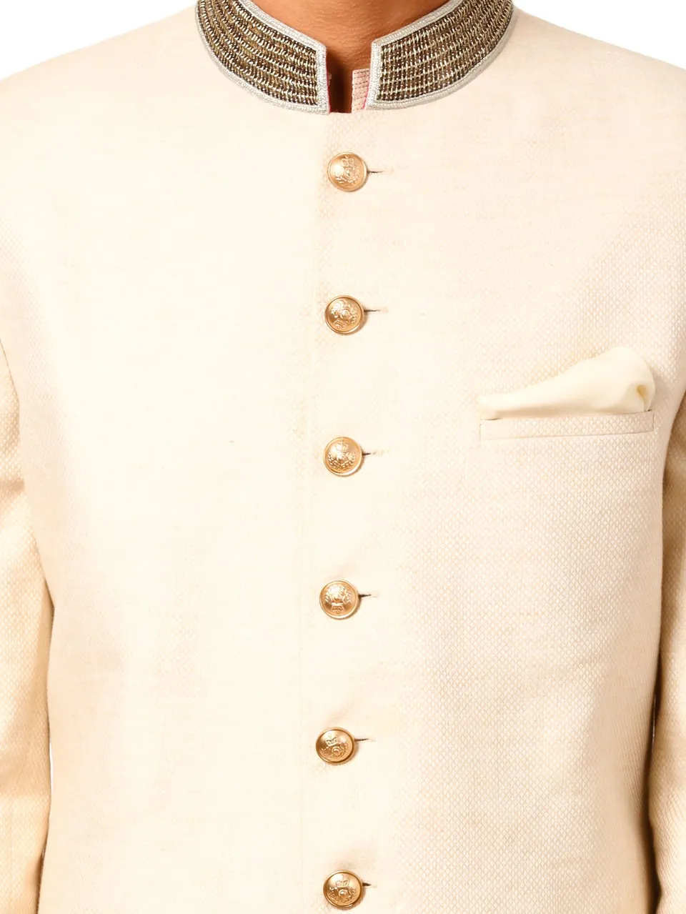 Close-up of the gold buttons and embroidered collar on the cream sherwani