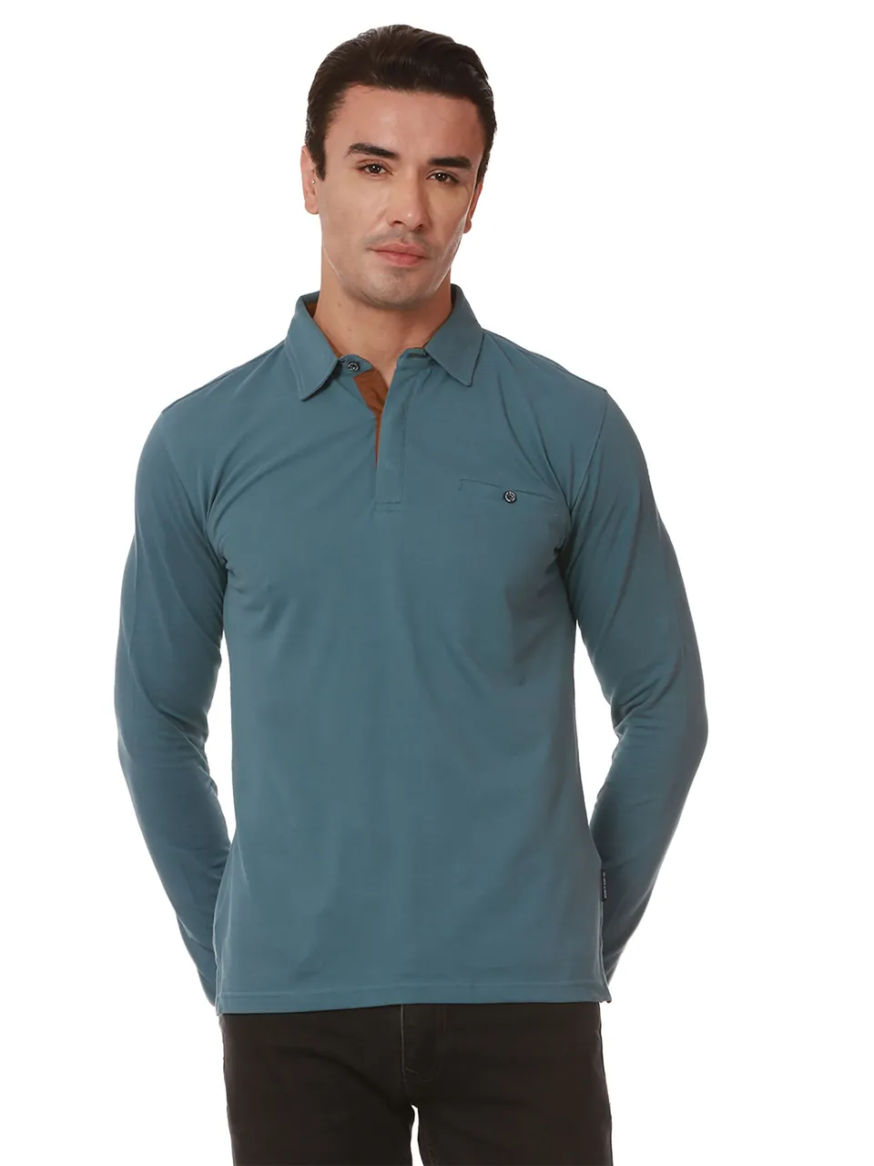 A male model in a teal long-sleeve polo, on white