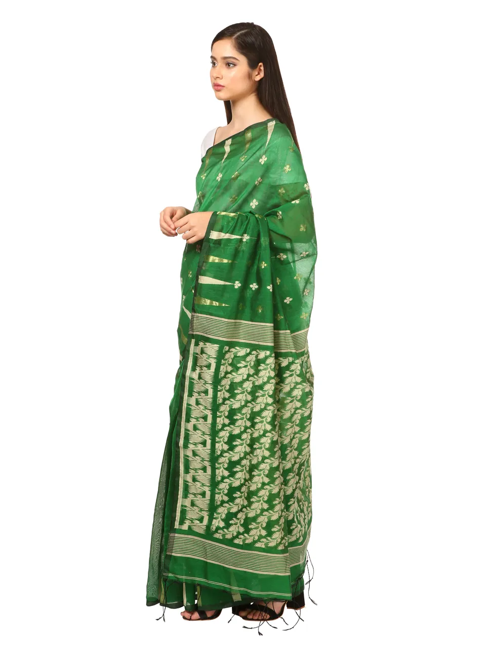 A model in a green saree with a white woven pattern on the pallu, on white