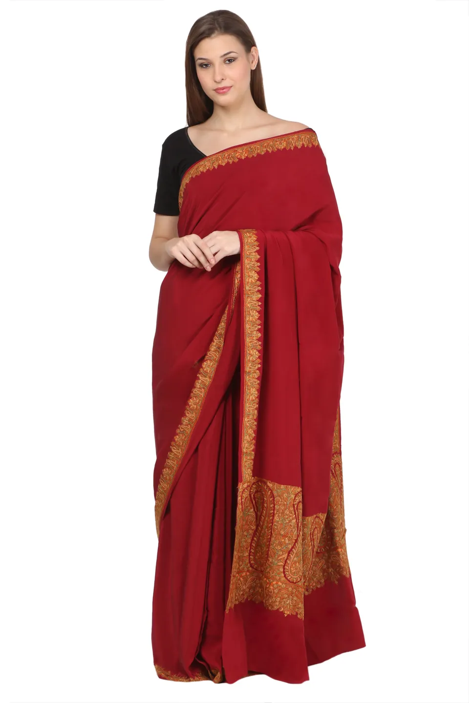 A model in a maroon saree with a wide embroidered paisley border, on white