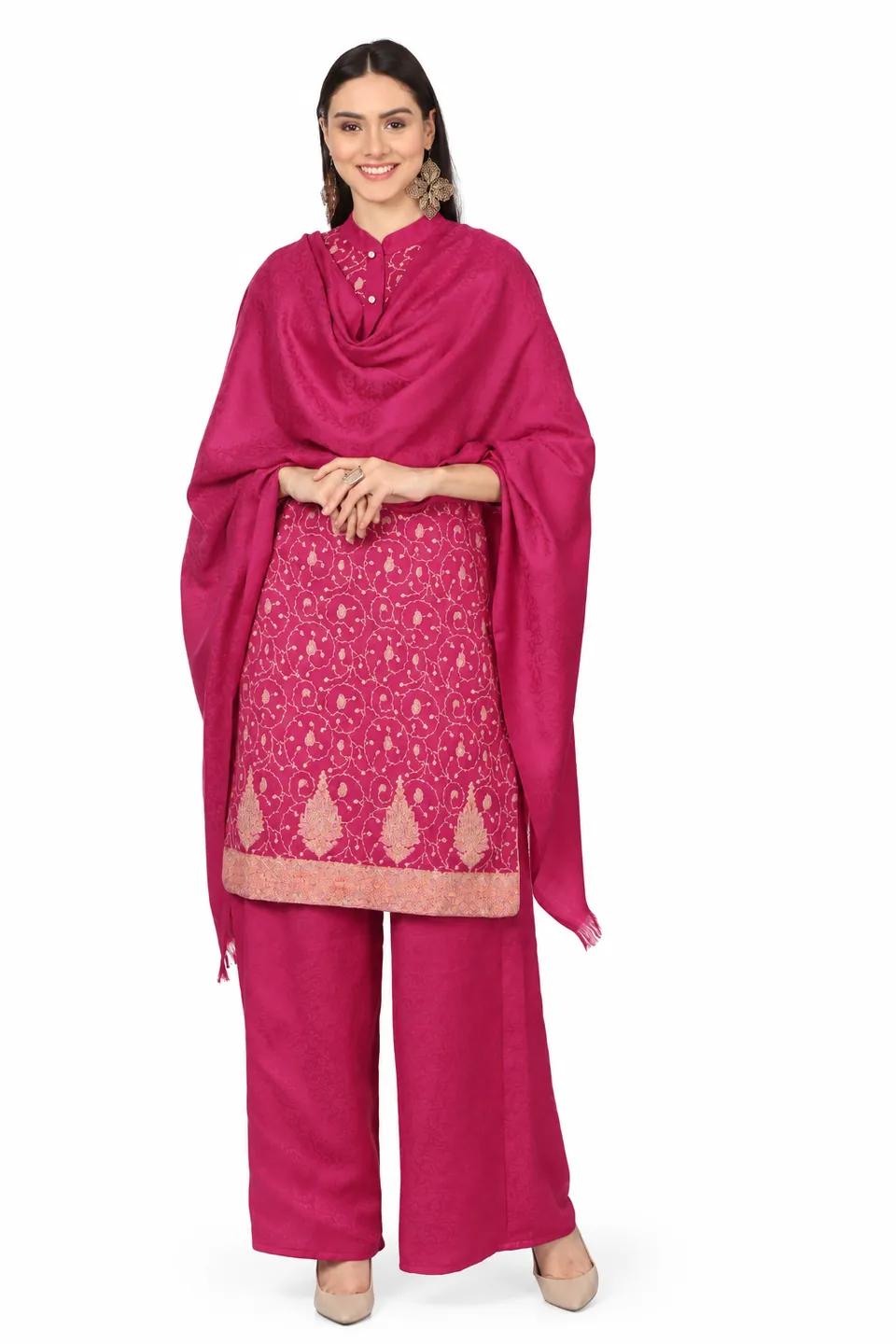 A smiling model in a magenta embroidered kurta set, a matching stole draped over both shoulders, on white